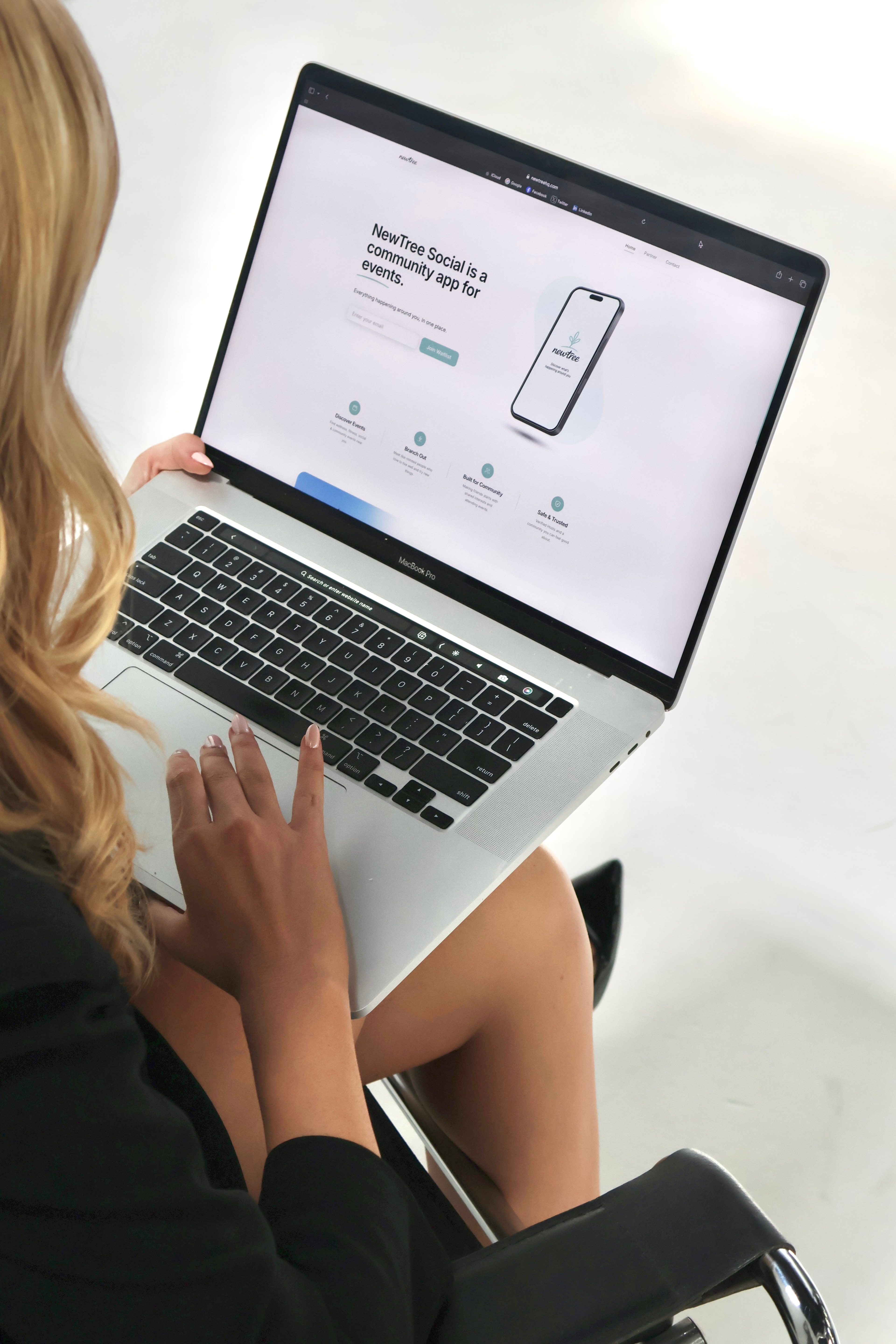 A laptop open to the NewTree website
